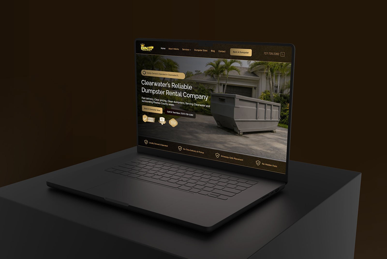 Laptop mockup showing the Bin King dumpster rental website homepage with dark gold branding and call-to-action buttons for service page