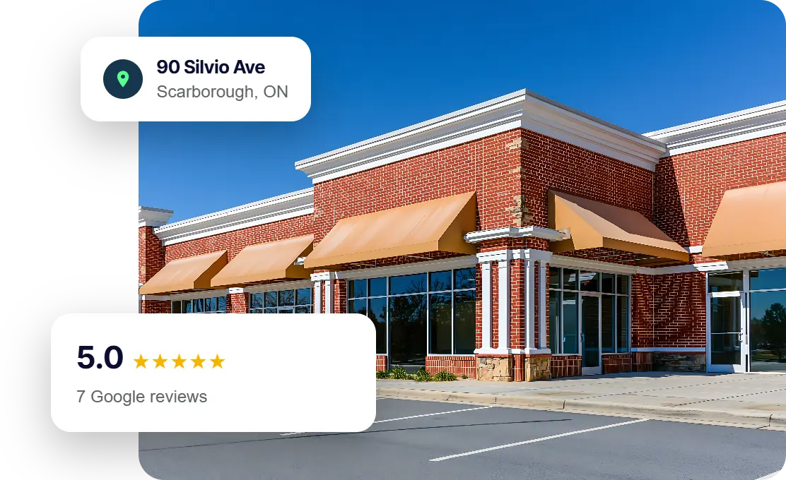 Small business storefronts in a retail plaza, with The Ant Firm's Scarborough address and 5.0 Google rating.