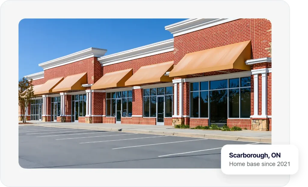 Row of small business storefronts in a retail plaza, The Ant Firm's home base is Scarborough, Ontario